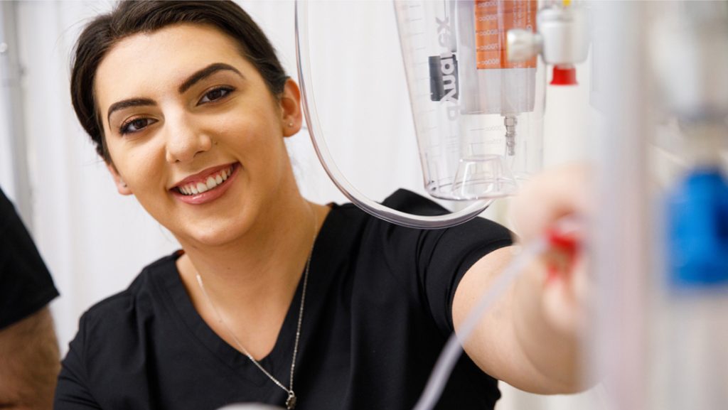 nursing student smiling at camera